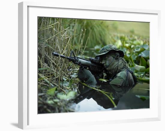 U.S. Navy SEAL Crosses Through a Stream During Combat Operations-Stocktrek Images-Framed Photographic Print