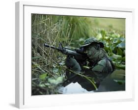 U.S. Navy SEAL Crosses Through a Stream During Combat Operations-Stocktrek Images-Framed Photographic Print