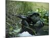 U.S. Navy SEAL Crosses Through a Stream During Combat Operations-Stocktrek Images-Mounted Photographic Print