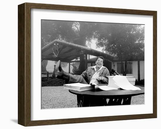 U.S. President Ronald Reagan Shows His Boot Following the Signing of His Tax Bill-null-Framed Photographic Print