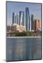 UAE, Abu Dhabi. Downtown waterfront skyscrapers.-Walter Bibikow-Mounted Photographic Print