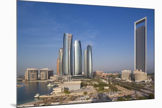 UAE, Abu Dhabi. Downtown waterfront skyscrapers.-Walter Bibikow-Mounted Premium Photographic Print