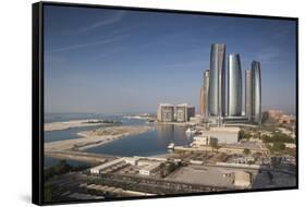 UAE, Abu Dhabi. Downtown waterfront skyscrapers.-Walter Bibikow-Framed Stretched Canvas