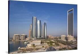 UAE, Abu Dhabi. Downtown waterfront skyscrapers.-Walter Bibikow-Stretched Canvas
