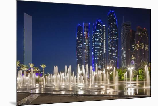 UAE, Abu Dhabi. Fountain in downtown at night.-Walter Bibikow-Mounted Premium Photographic Print