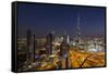 UAE, Downtown Dubai. Cityscape with Burj Khalifa at night.-Walter Bibikow-Framed Stretched Canvas