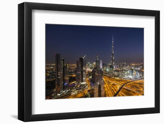 UAE, Downtown Dubai. Cityscape with Burj Khalifa at night.-Walter Bibikow-Framed Photographic Print