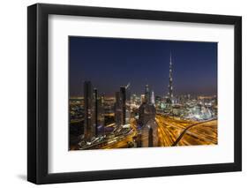 UAE, Downtown Dubai. Cityscape with Burj Khalifa at night.-Walter Bibikow-Framed Photographic Print