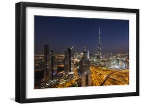 UAE, Downtown Dubai. Cityscape with Burj Khalifa at night.-Walter Bibikow-Framed Photographic Print