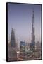 UAE, Downtown Dubai. Cityscape with Burj Khalifa at night.-Walter Bibikow-Framed Stretched Canvas