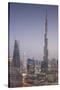 UAE, Downtown Dubai. Cityscape with Burj Khalifa at night.-Walter Bibikow-Stretched Canvas