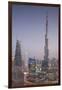 UAE, Downtown Dubai. Cityscape with Burj Khalifa at night.-Walter Bibikow-Framed Premium Photographic Print