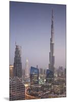 UAE, Downtown Dubai. Cityscape with Burj Khalifa at night.-Walter Bibikow-Mounted Premium Photographic Print