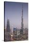 UAE, Downtown Dubai. Cityscape with Burj Khalifa at night.-Walter Bibikow-Stretched Canvas