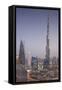 UAE, Downtown Dubai. Cityscape with Burj Khalifa at night.-Walter Bibikow-Framed Stretched Canvas