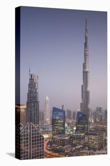 UAE, Downtown Dubai. Cityscape with Burj Khalifa at night.-Walter Bibikow-Stretched Canvas