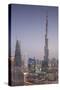 UAE, Downtown Dubai. Cityscape with Burj Khalifa at night.-Walter Bibikow-Stretched Canvas