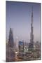 UAE, Downtown Dubai. Cityscape with Burj Khalifa at night.-Walter Bibikow-Mounted Photographic Print