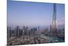 UAE, Downtown Dubai. Cityscape with Burj Khalifa.-Walter Bibikow-Mounted Premium Photographic Print