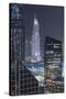 UAE, Downtown Dubai. Downtown cityscape at night lit in blue.-Walter Bibikow-Stretched Canvas