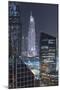 UAE, Downtown Dubai. Downtown cityscape at night lit in blue.-Walter Bibikow-Mounted Premium Photographic Print