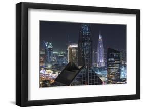 UAE, Downtown Dubai. Downtown cityscape at night lit in blue.-Walter Bibikow-Framed Photographic Print