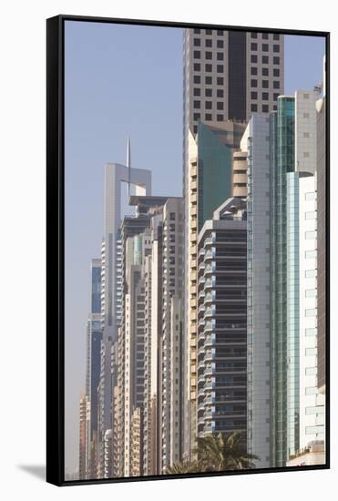 UAE, Downtown Dubai. High-rise buildings along Sheikh Zayed Road-Walter Bibikow-Framed Stretched Canvas