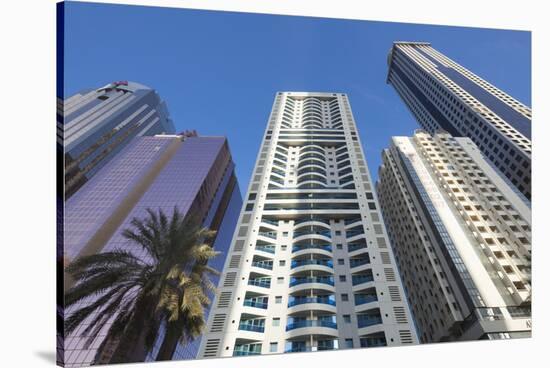 UAE, Downtown Dubai. High-rise buildings along Sheikh Zayed Road-Walter Bibikow-Stretched Canvas