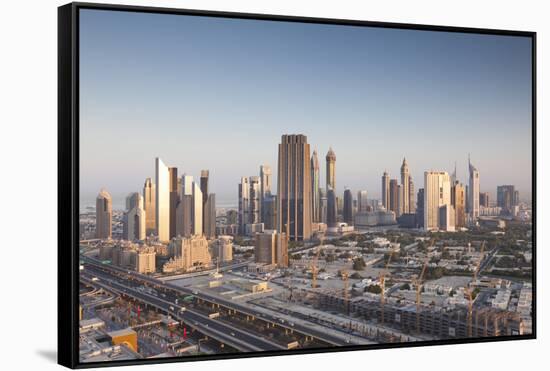 UAE, Downtown Dubai. Skyscrapers on Sheikh Zayed Road from downtown-Walter Bibikow-Framed Stretched Canvas