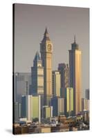 UAE, Dubai, Jumeirah. Skyscrapers seen from Jumeirah-Walter Bibikow-Stretched Canvas