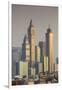 UAE, Dubai, Jumeirah. Skyscrapers seen from Jumeirah-Walter Bibikow-Framed Premium Photographic Print