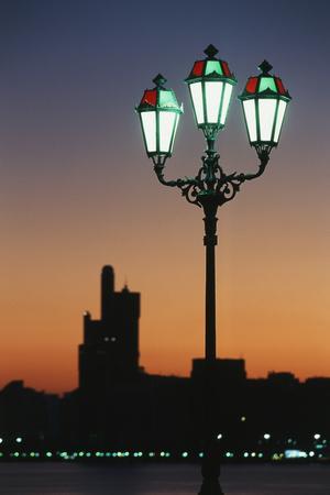 https://imgc.allpostersimages.com/img/posters/uae-united-arab-emirates-abu-dhabi-city-and-arabic-streetlamps_u-L-PRPUNV0.jpg?artPerspective=n