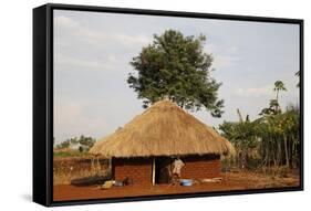 Ugandan child outside his home, Bweyale, Uganda-Godong-Framed Stretched Canvas