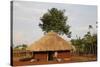 Ugandan child outside his home, Bweyale, Uganda-Godong-Stretched Canvas