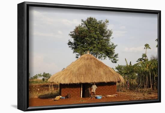 Ugandan child outside his home, Bweyale, Uganda-Godong-Framed Photographic Print