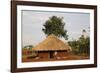 Ugandan child outside his home, Bweyale, Uganda-Godong-Framed Photographic Print