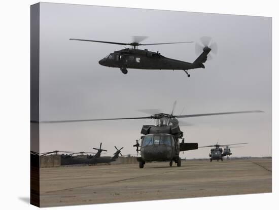 UH-60 Black Hawks Taxis Out for a Mission over Northern Iraq-null-Stretched Canvas