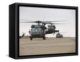 UH-60 Black Hawks Taxis Out for a Mission over Northern Iraq-null-Framed Stretched Canvas