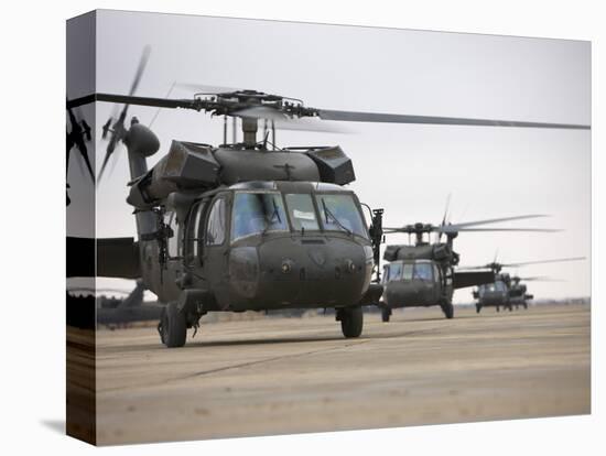 UH-60 Black Hawks Taxis Out for a Mission over Northern Iraq-null-Stretched Canvas