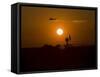 UH-60 Blackhawk Flies over Camp Speicher Airfield at Sunset-Stocktrek Images-Framed Stretched Canvas