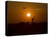 UH-60 Blackhawk Flies over Camp Speicher Airfield at Sunset-Stocktrek Images-Stretched Canvas