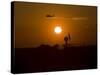 UH-60 Blackhawk Flies over Camp Speicher Airfield at Sunset-Stocktrek Images-Stretched Canvas