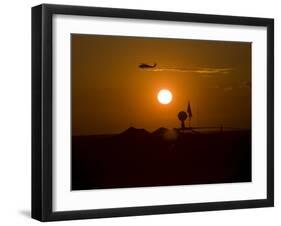 UH-60 Blackhawk Flies over Camp Speicher Airfield at Sunset-Stocktrek Images-Framed Photographic Print