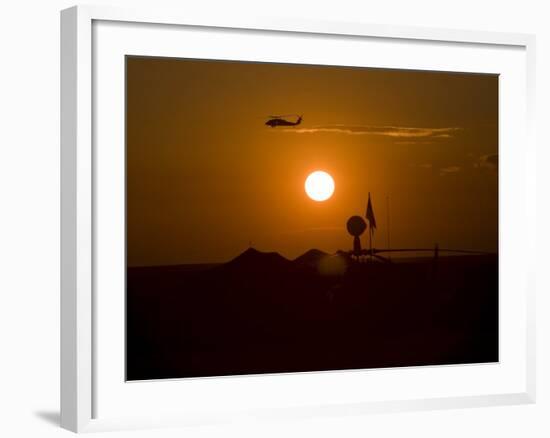 UH-60 Blackhawk Flies over Camp Speicher Airfield at Sunset-Stocktrek Images-Framed Photographic Print