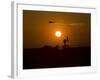 UH-60 Blackhawk Flies over Camp Speicher Airfield at Sunset-Stocktrek Images-Framed Photographic Print