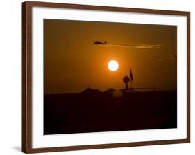 UH-60 Blackhawk Flies over Camp Speicher Airfield at Sunset-Stocktrek Images-Framed Photographic Print