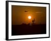 UH-60 Blackhawk Flies over Camp Speicher Airfield at Sunset-Stocktrek Images-Framed Photographic Print