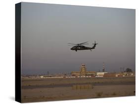 UH-60 Blackhawk Helicopter Flies Past the Tower on Camp Speicher-Stocktrek Images-Stretched Canvas