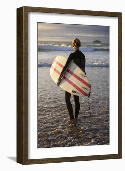 Uk, Cornwall, Polzeath. a Woman Looks Out to See, Preparing for an Evening Surf. Mr-Niels Van Gijn-Framed Photographic Print