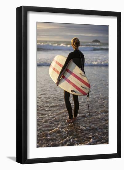 Uk, Cornwall, Polzeath. a Woman Looks Out to See, Preparing for an Evening Surf. Mr-Niels Van Gijn-Framed Photographic Print